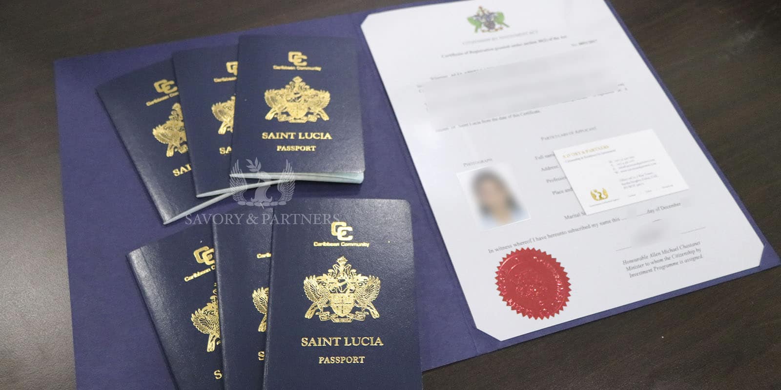 Saint Lucia passports for a family of 6 at Savory & Partners office in Dubai, UAE.